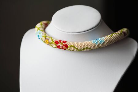 Beaded crochet necklace with floral pattern close upの写真素材