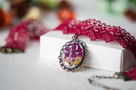 Handmade choker necklace from lace and pendant with natural flowersの写真素材