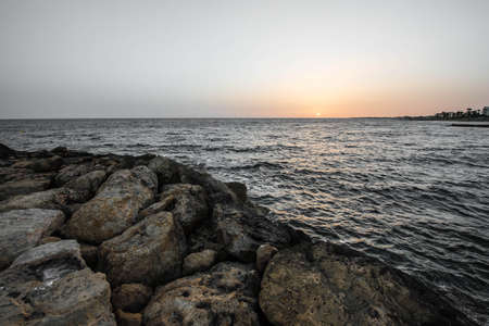 Sunset over the sea on the Mediterranean coastの写真素材