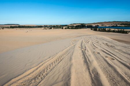 Blue sky over sand dunes in the eveningの写真素材