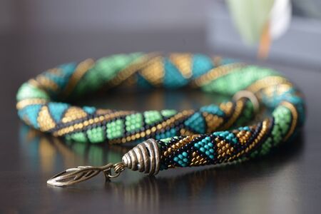 Handmade beaded crochet necklace with geometrical patternの写真素材