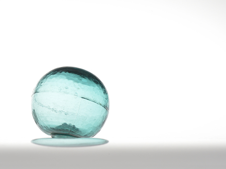 Glass ball on a white backgroundの写真素材