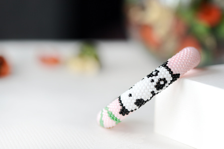 Pink bracelet with panda close upの写真素材