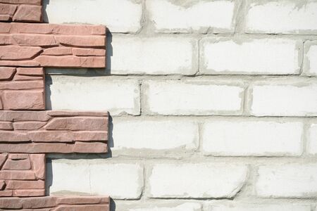 Brick wall and a fragment of the decoration as a background