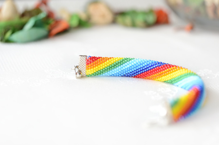 Handmade crocheted bracelet rainbow colors close upの写真素材