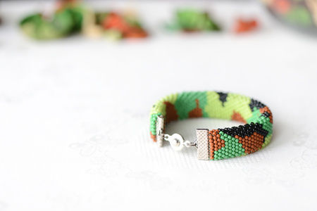 Bead crochet bracelet in military style, camouflage coloringの写真素材