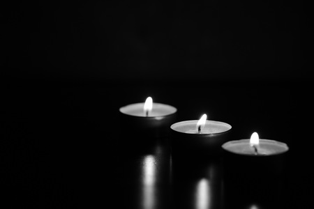 Burning candles in the dark. Black and whiteの写真素材