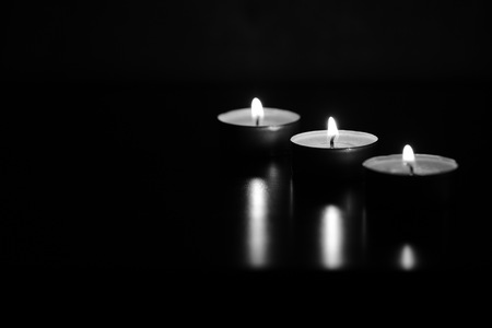 Burning candles in the dark. Black and whiteの写真素材
