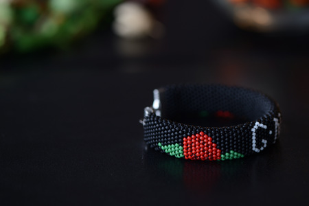 Black beaded bracelet on a dark background close upの写真素材