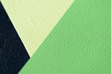 Colorful cardboads on a dark leather background close upの写真素材