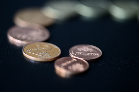 Belarusian coins scattered on a dark surface close upの写真素材