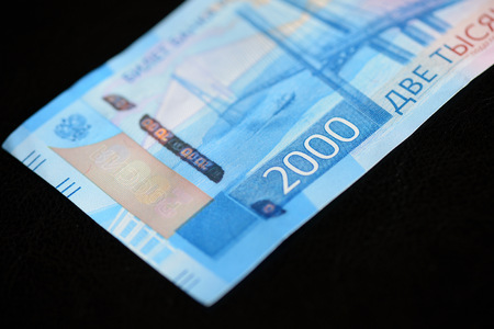 Russian banknote in two thousand rubles on a dark background close up