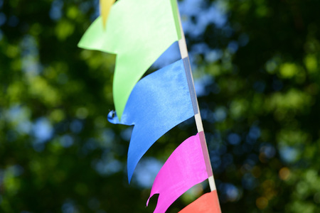 Colorful party garland in the city park close upの写真素材