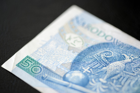 Fifty Polish zlotys on a dark background close upの写真素材