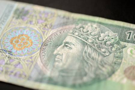 A hundred Polish zlotys on a dark background close upの写真素材