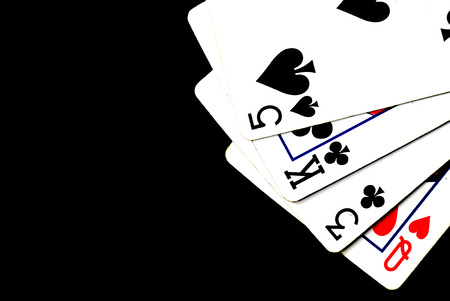 Playing cards on a dark background close up