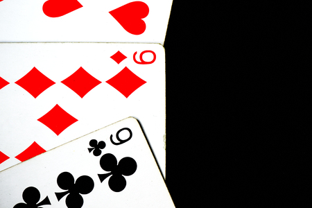 Playing cards on a dark background close up
