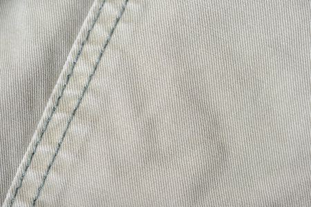 Olive green denim texture and background close up