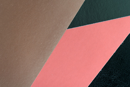 Colorful sheets of paper on a dark background close upの写真素材