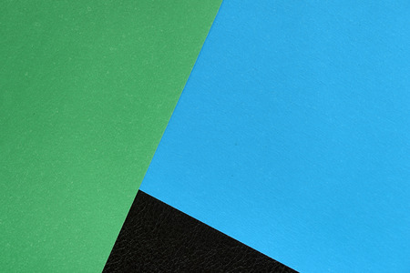 Colorful sheets of paper on a dark background close upの写真素材