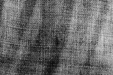 Monochrome old torn jeans texture and background close upの写真素材
