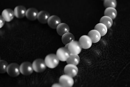 Stone necklace on a dark background close up. Black and whiteの写真素材