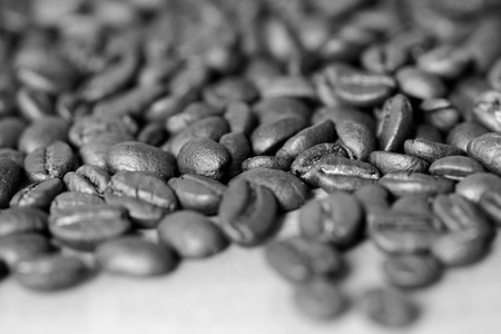 Roasted coffee beans on a wooden background. Black and whiteの写真素材