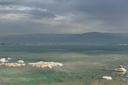 Dead Sea and overcast sky in cloudy weatherの写真素材