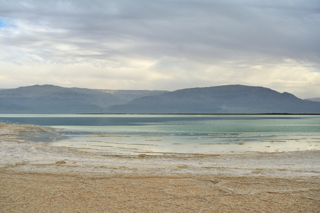 Dead Sea and overcast sky in cloudy weatherの写真素材