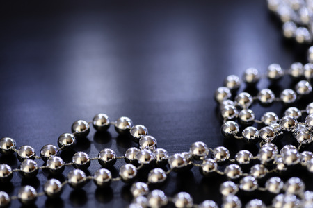 Silver Christmas decoration on a dark background close upの写真素材