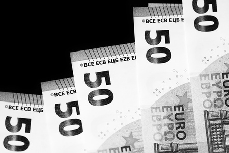 Fifty euro banknotes on a dark background close up. Black and whiteの写真素材