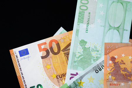 One Hundred and Fifty euro banknotes on a dark background close upの写真素材