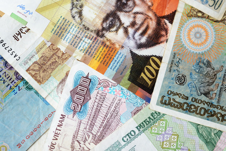 Different countries money background close up. Belarusian rubles, Georgian lari, Polish zloty,...