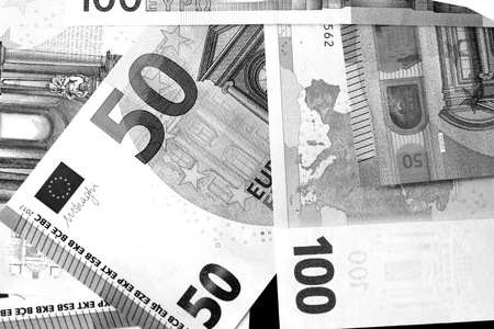 One Hundred and Fifty euro banknotes close up in black and white style