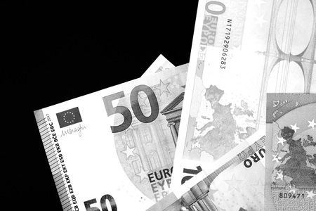 One Hundred and Fifty euro banknotes close up in black and white style