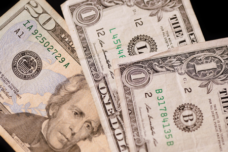 American dollars on a dark background. Brown color toned