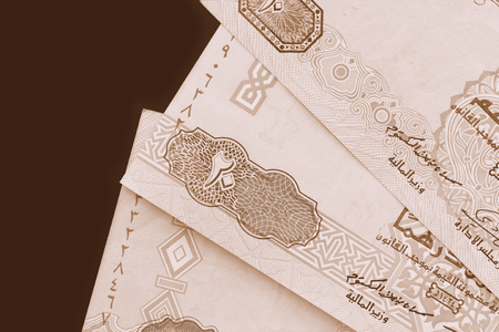 UAE dirham currency background close up. Brown color toned