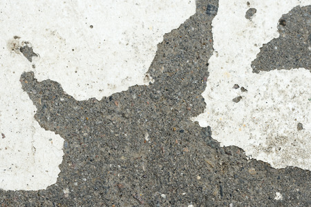 White paint on the old asphalt closeup. Abstract backgroundの写真素材