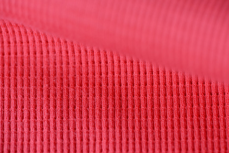 Textile texture coral color close up. Textile background