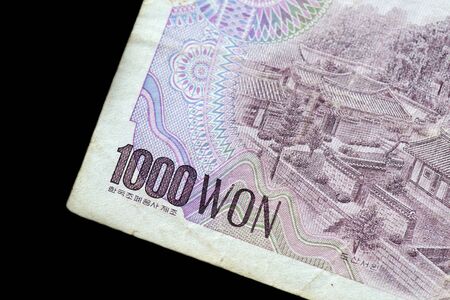 Outdated 1000 Korean Won note of 1983 issued on a black background close-upの写真素材