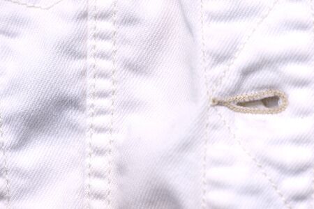 White jeans jacket texture close up. Denim background