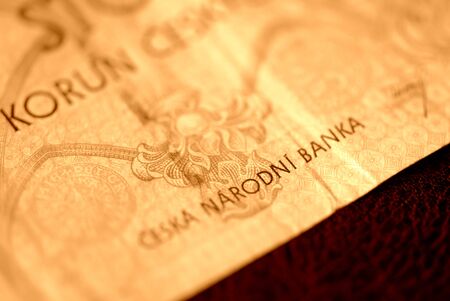 One hundred Czech crown banknote on a dark background close up. Brown color toned