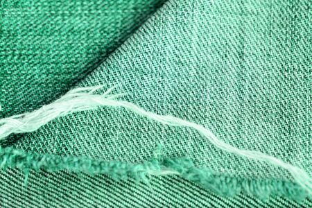 Old jeans texture close up. Green denim backgroundの写真素材