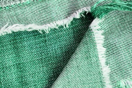 Old jeans texture close up. Green denim backgroundの写真素材