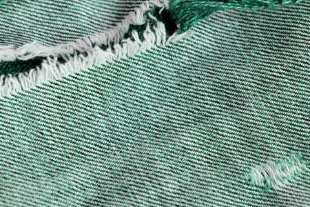Old jeans texture close up. Green denim backgroundの写真素材