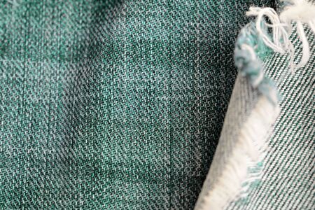 Old jeans texture close up. Green denim backgroundの写真素材