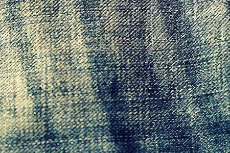 Old torn jeans close-up. Denim backgroundの写真素材