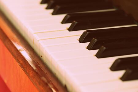 Old vintage piano brown color close-up. Retro styleの写真素材