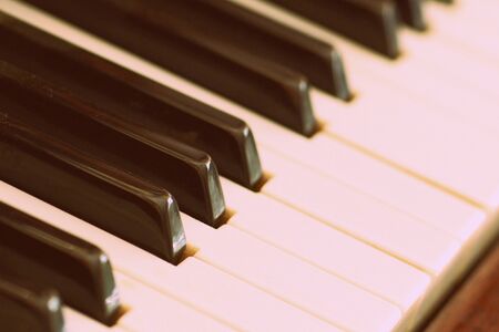 Old vintage piano brown color close-up. Retro styleの写真素材