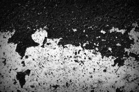 Old dirty asphalt texture with white paint on it. Top viewの写真素材